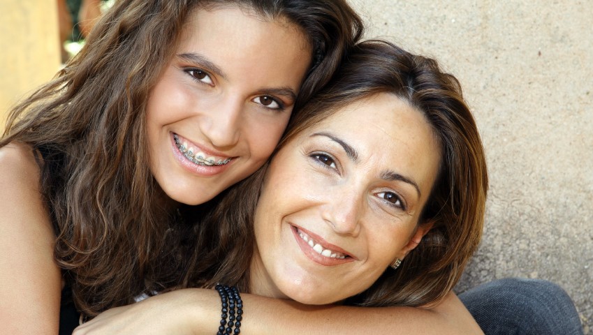 Teen Hugging Her Mother